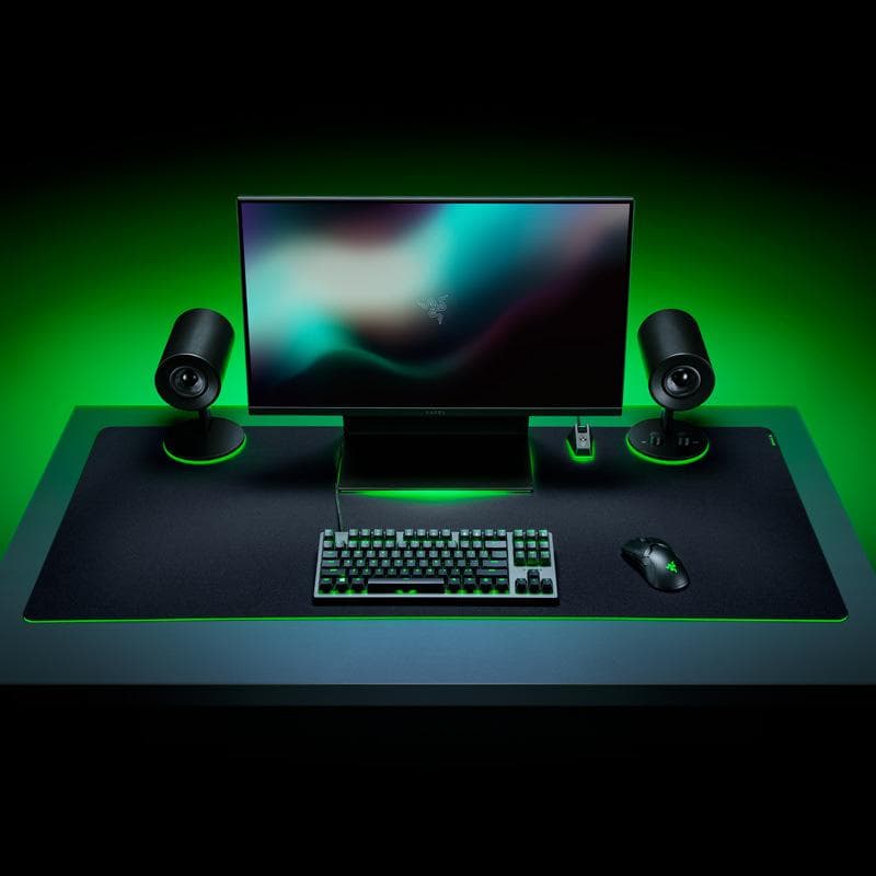 Razer gaming headset resting beside its charging cable