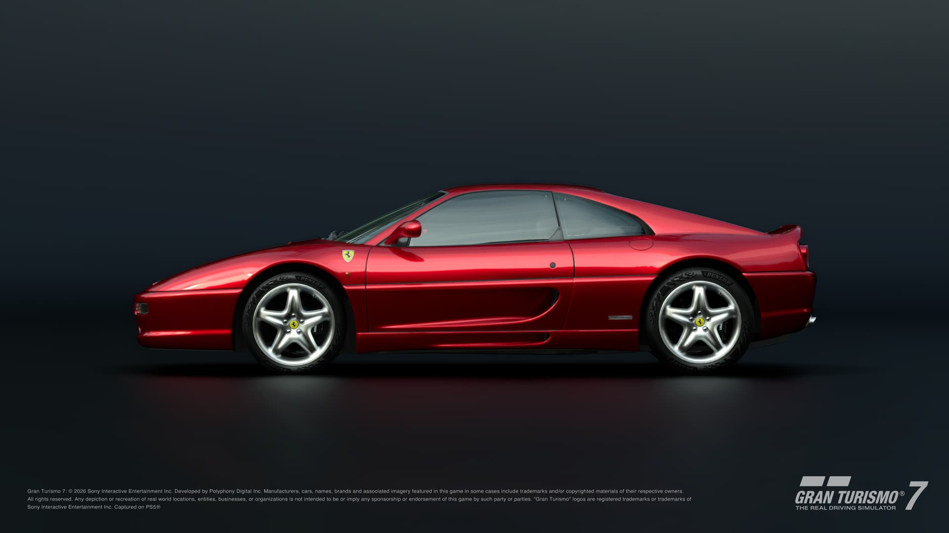 Red Ferrari F355 Berlinetta viewed from the side in GT7.