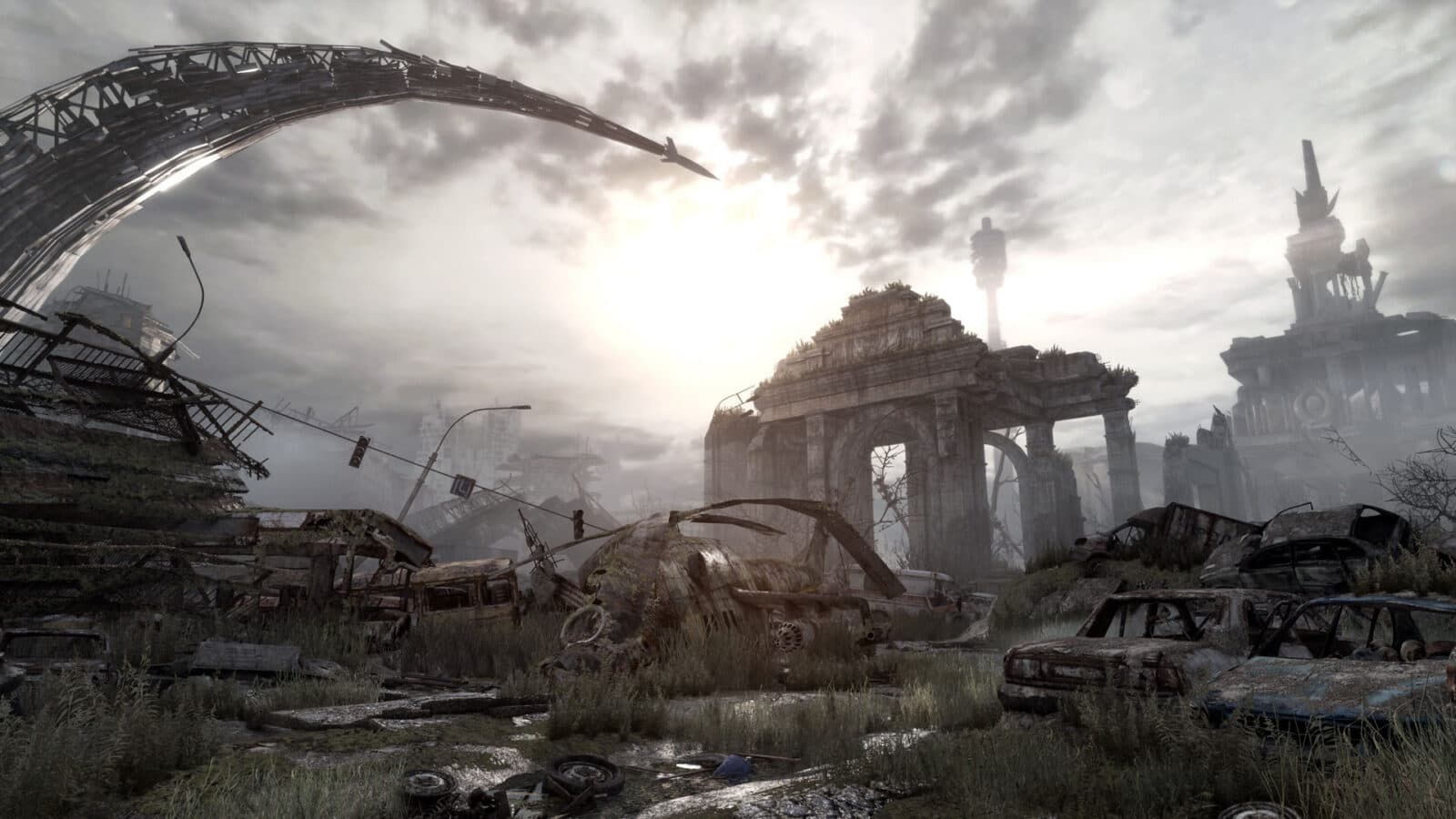 Ruined stone buildings and a broken overhead structure beneath a pale sky.