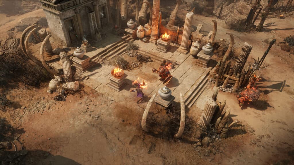 An overhead game view shows combat around a ruined stone courtyard.