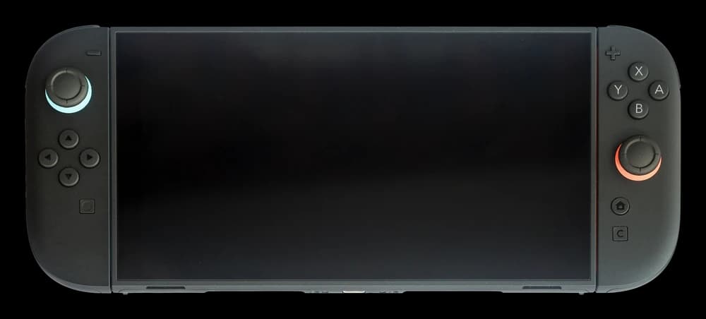 Nintendo Switch 2 in handheld mode, photographed from the front with both Joy-Con 2 controllers attached.
